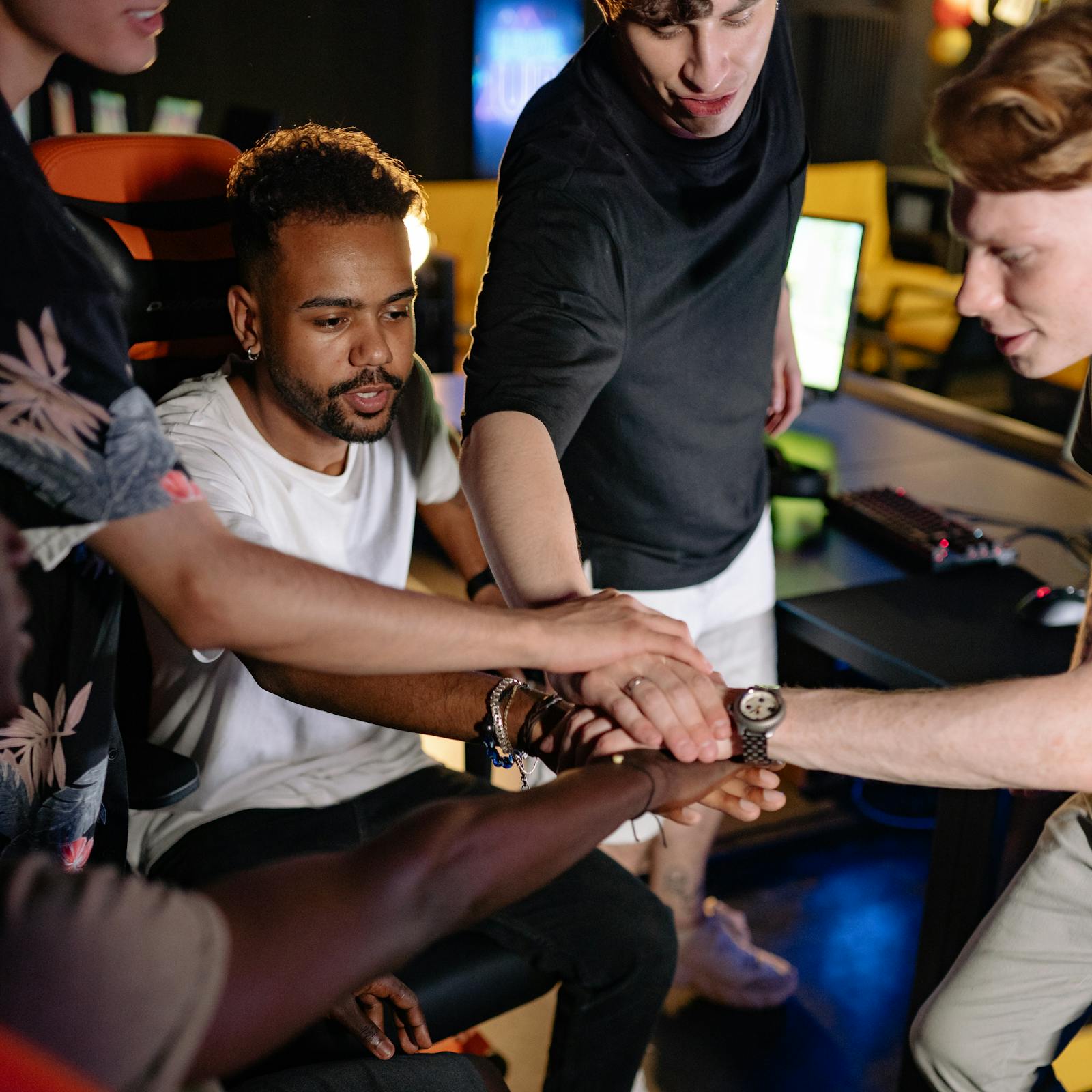 A group of hands joined together representing teamwork
