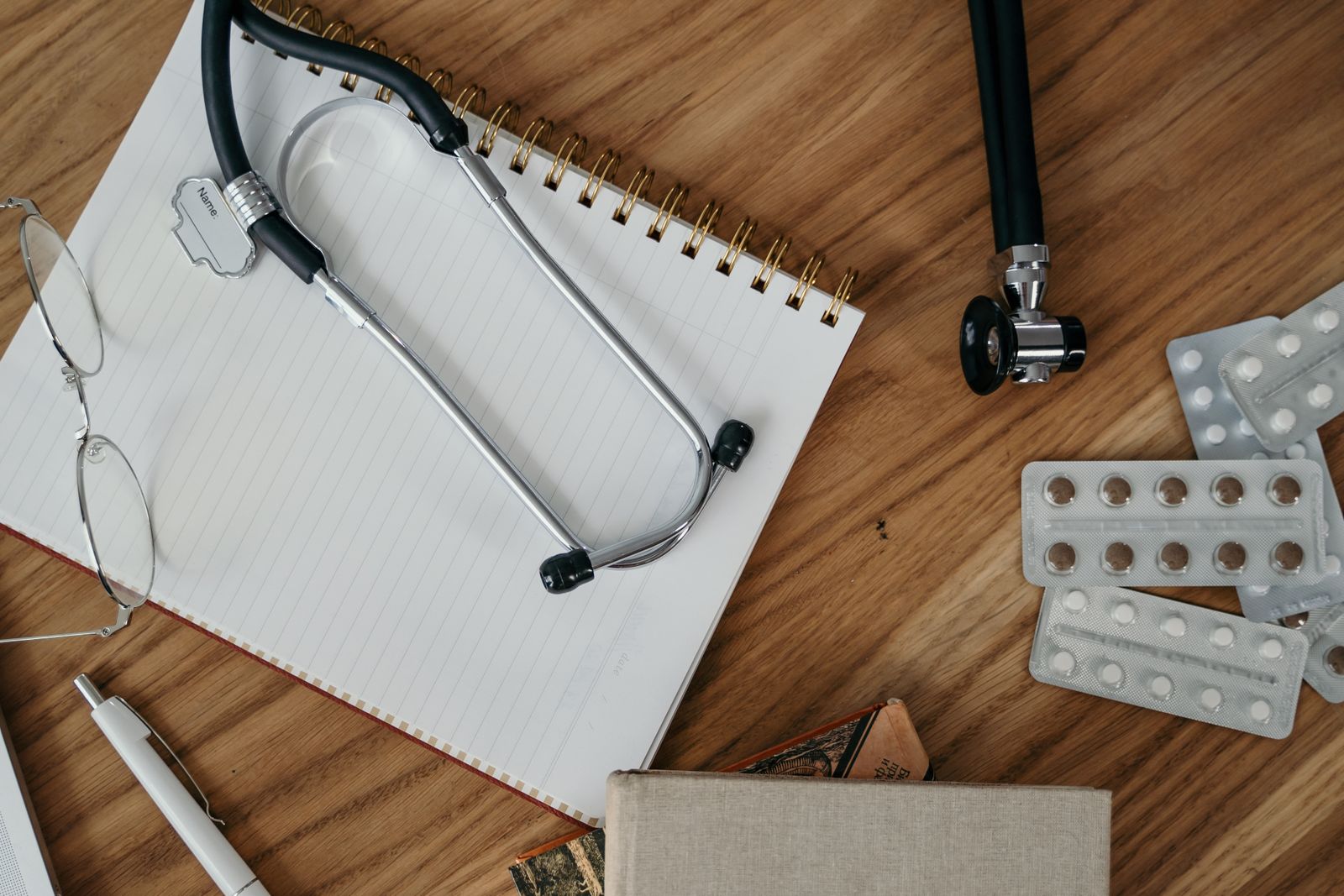 Stethoscope on a notebook with study materials
